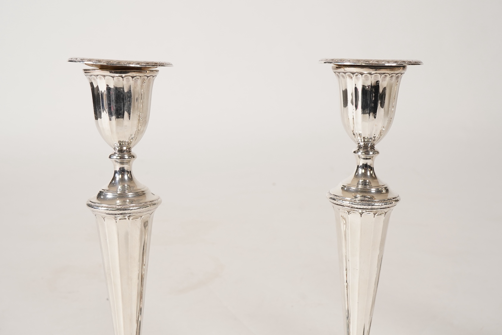 A set of four George III silver candlesticks, by John Green, Roberts, Mosley & Co